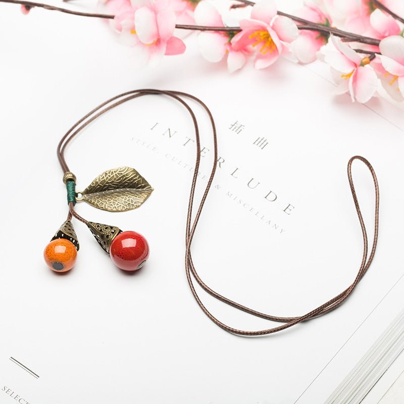 Leaf and Berries Ceramic Pendant Long Leather Rope Chain Ceramic Ball Pendant Vintage Sweater Necklace for Women Clothing Jewelry Accessories Gift - I Love Heartstrings